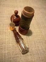 Old perfume bottle in a wooden holder