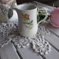 Cream-colored small porcelain spout, jug, milk spout