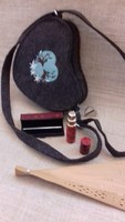 Handcrafted bag with a fan decorated with a brand marked mountain grass pair embroidery