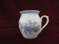 Zsolnay porcelain hasas mug with blue floral pattern on a white background, worn inside. He has!