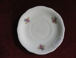 Zsolnay porcelain coffee cup placemat. Cream-colored with a small floral pattern. Antique. He has!