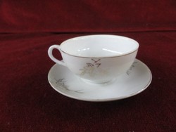 German quality porcelain, coffee cup + placemat. Gold pattern with gold border. He has!