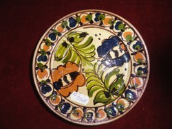 Mini ceramic wall plate, with a folk pattern, hand painted. He has!