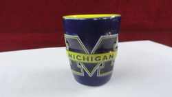 Michigan sports association brandy cup, m go blue. Dark blue outside, yellow inside. He has!