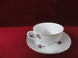 Chinese porcelain teacup + placemat with small purple flowers on a snow-white background. He has!