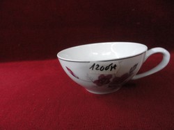 Porcelain tea cup with a beautiful cyclamen colored flower. He has!