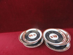 Porcelain tea cup coaster, set of 6 with gold and brown pattern. He has!