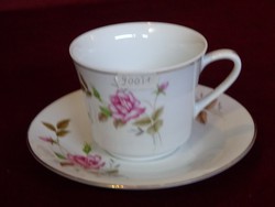 Chinese tea cup + saucer. He has!