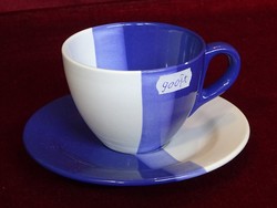 Porcelain tea cup + saucer, blue/white. Modern lines. He has!