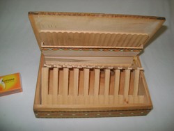 Retro cigarette holder, wooden box offering cigarettes