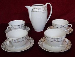 Lowland porcelain tea set with four cups + tea pourer. He has!