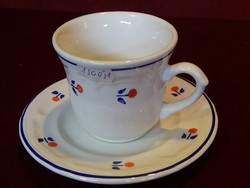 German coffee cup + coaster, with red/blue pattern. He has!