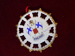 Swedish porcelain wall decoration with Finnish flag. With a diameter of 12 cm. He has!