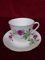 Tientsin porcelain coffee cup + placemat with rose pattern. He has!