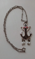 Fire enamel anchor-shaped pendant on a chain with twisted links