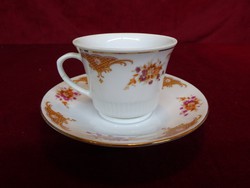 Oriental porcelain coffee cup + placemat, so far standing in a display case. He has!