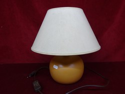 Reading lamp with ceramic base and paper cover. He has!