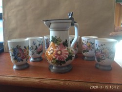 Tin-covered majolica wine jug with glasses