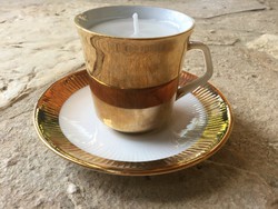 Gold-plated Bavarian porcelain coffee cup and saucer in a pair of gift scented candles with cream spout
