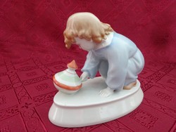 Zsolnay porcelain, figural sculpture. Child playing with a snail. Length: 16 cm. He has!