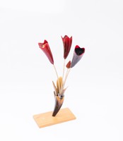 Horn bouquet of flowers on a wooden base, a rare ornament