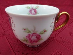 Czech porcelain, hand-painted, rose-patterned coffee cup. He has!