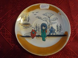 Japanese porcelain coffee cup placemat with green figure. He has!