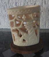 Carved bone on a wooden pedestal - ornament