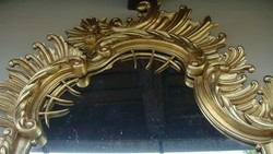 Large cantilevered baroque renovated gilded mirror