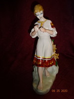 Russian porcelain statue, girl counting flower petals. He has!