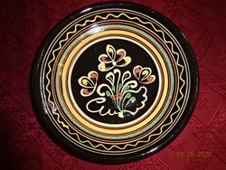German glazed ceramic wall plate, diameter 22.5 cm. He has!
