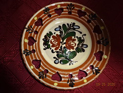 German glazed ceramic wall plate, diameter 18.5 cm. He has!