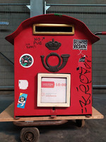 Antique mailbox with red post box with Belgian royal coat of arms key