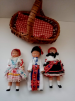 3- Pieces of a small rubber doll in old folk clothes in a small wicker basket for sale together