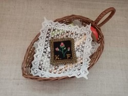 Old wicker basket inside crocheted tablecloth crochet needle with wooden needle holder pincushion wooden ornament buttons scissors