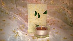 Green-gold candlestick candle as a gift