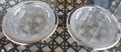 A pair of glass bowls with metal bands