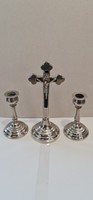 Marked metal crucifix with two candle holders.