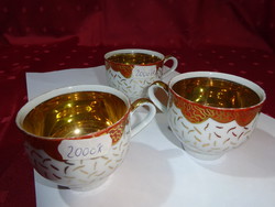 German porcelain coffee cup, gold inside, gold cirada on the outside. He has!
