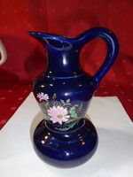 German porcelain jug decorated with beautiful flowers on a cobalt blue background. He has!