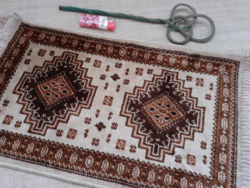 Handwoven small wool prayer rug in good condition as a gift with a small wooden duster