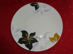 German porcelain flat plate with black / gold flower, diameter 25 cm. He has!