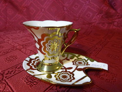 Porcelán kávéscsésze + alátét, dúsan aranyozott, az alátét hossza 12,5 cm.