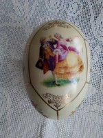 Old cream-colored porcelain egg with a hand-painted scene and a number pressed into the mass!
