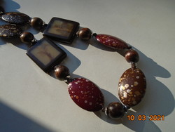 Spectacular long vintage necklace made of large burgundy-brown and wooden beads with polished stone effect ornaments