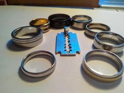 8 stainless steel rings + a blade pendant