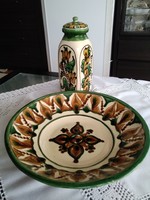 The ceramic works of the folk craftsman István Garga decorated with folk motifs together.