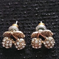 Very showy old silver earrings decorated with small stones in the form of a cherry