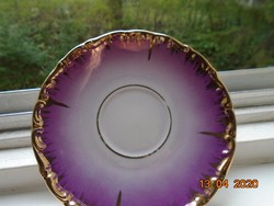 Richly hand-gilded pinkish purple plate with German and Austrian markings