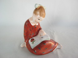 Girl reading a ceramic book in Bodrogkeresztúr